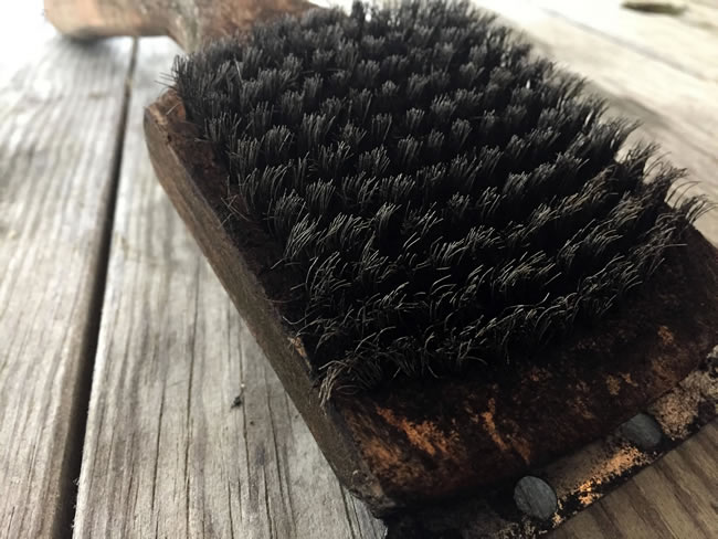 Close up photo of wire brush grill cleaner.